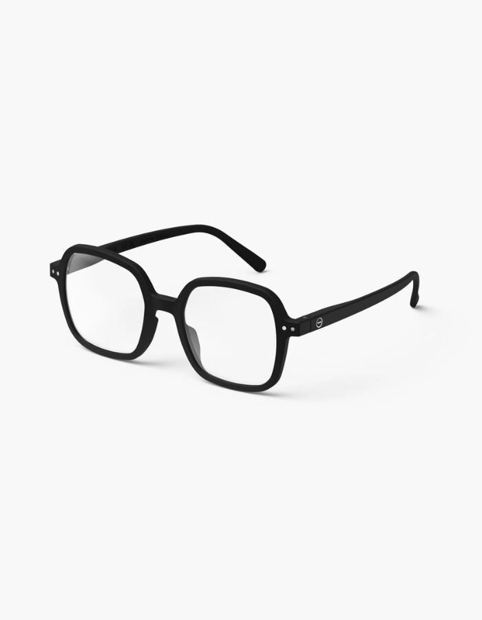 Lunettes noires sur texture jean
